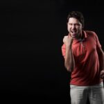 Man showing how happy he is after his achievements